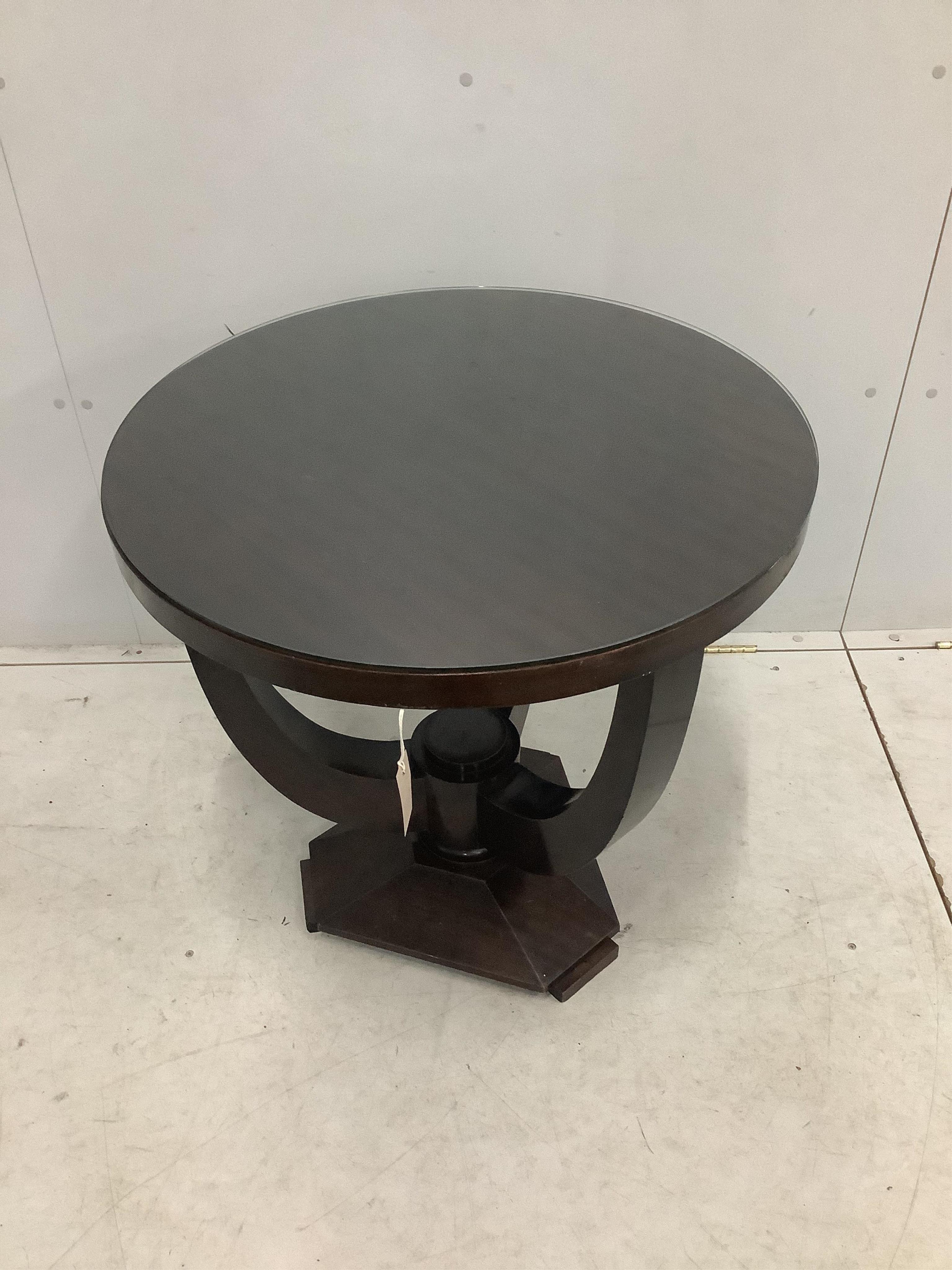 An Art Deco circular mahogany occasional table, diameter 70cm, height 71cm. Condition - fair